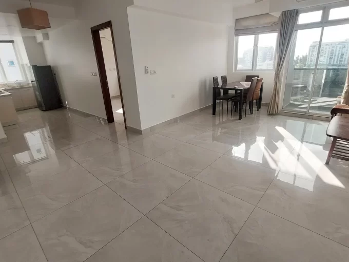 Unfurnished 3 bedroom apartment in Amin Avenue Oak, Hulhumale'. A photo of the living room, balcony and kitchen.