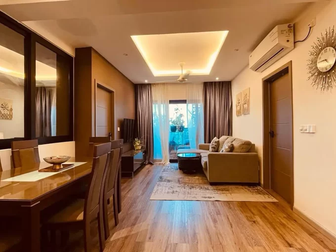 Fully furnished 3+1 bedroom apartment on the 6th floor of Fitron Residences, Hulhumale'. Security Deposit is 2 Month's Rent. A photo of the living area and dining area.