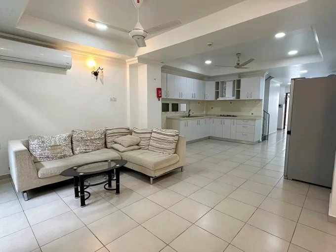 Semi furnished 3 bedroom apartment in Lily Magu, Male'. A photo of the living area and kitchen.