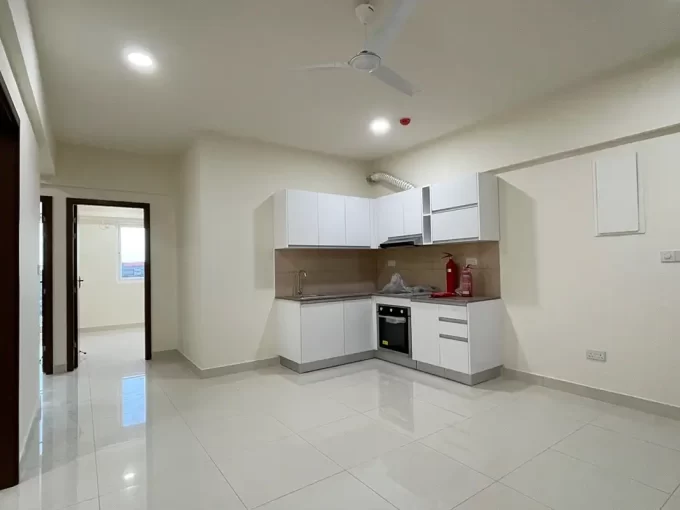 Unfurnished 3 bedroom apartment in One Central Park, Hulhumale'. A photo of the living area and kitchen.