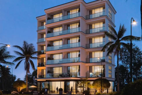 fully furnished 1 bedroom apartment sale The Bay by Premier, Addu City Feydhoo. A 3d render of the facade at night time.