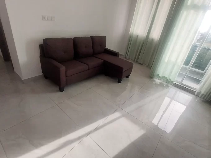 Fully furnished 3 bedroom apartment on the 5th floor of Amin Avenue Teak, Hulhumale'. A photo of the living area and balcony.