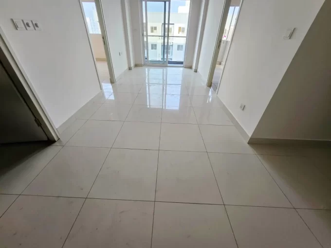 Unfurnished 2+1 bedroom apartment for sale in Phase 2, Hulhumale'. The unit is on the 14th floor of the building. A photo of the living area.