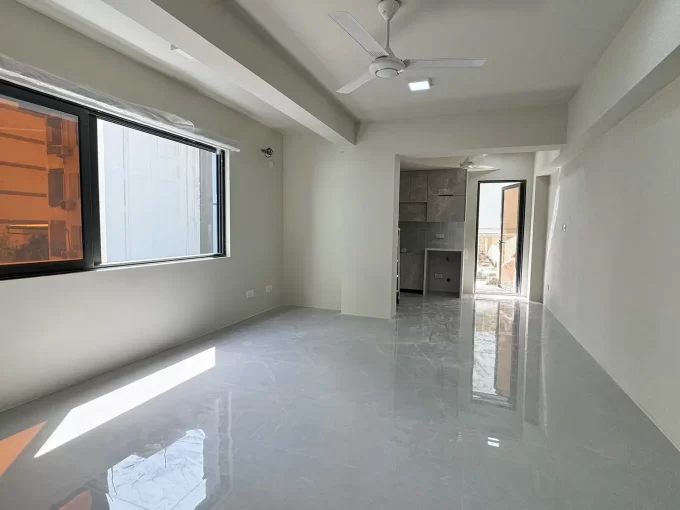 Unfurnished 2 bedroom apartment on the 2nd floor of a residential building in Burevi Magu, Henveyru, Male'. A photo of the living area.