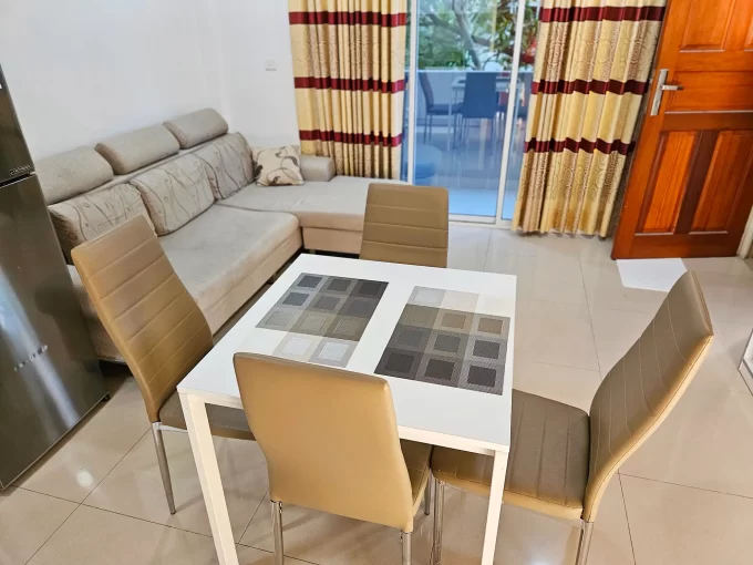 Fully furnished 2 bedroom apartment on the 2nd floor of a residential building in Halaveli Magu, Hulhumale' Phase 1. A photo of the living and dining area.