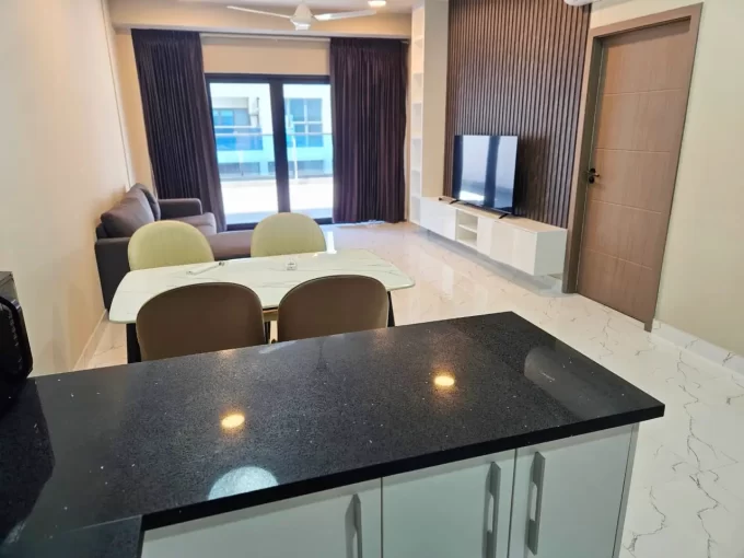 Fully furnished 2+1 bedroom apartment in Fitron Residences, 3rd Floor, Hulhumale'. The apartment comes with a large terrace balcony. A photo of the dining area and living area.