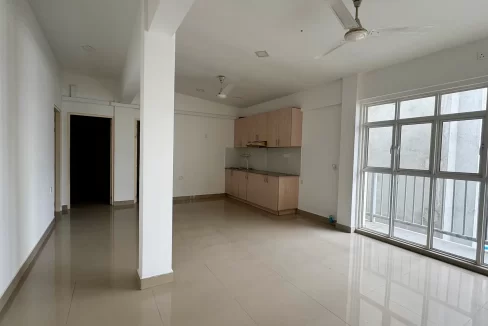 Unfurnished 4 bedroom apartment from the 5th floor of a residential building in Rahdhebai Magu, Galolhu, Male'. A photo of the living room, kitchen and dining area.