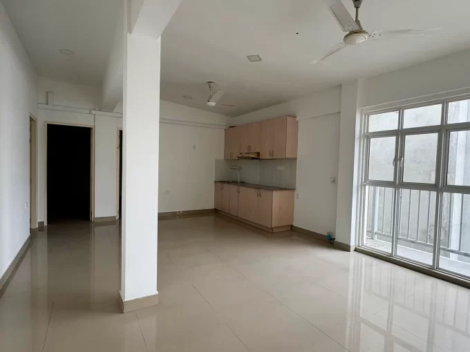 Unfurnished 4 bedroom apartment from the 5th floor of a residential building in Rahdhebai Magu, Galolhu, Male'. A photo of the living room, kitchen and dining area.